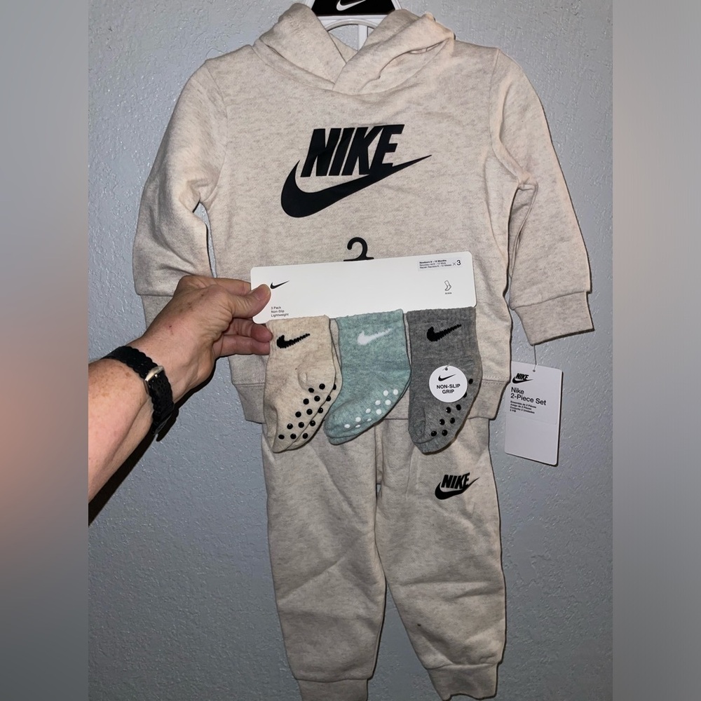 Nike NWT, 12months sweat suit, beige in color including 3 prs Nike socks.